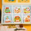 Santa Friends Collection Thumbnail â Eco Sponge Gift Box | Doyourclean Santa Friends cellulose sponge set displayed with Doyourclean box and holiday decorations on yellow background.