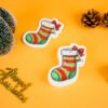 Christmas Friends â Christmas Stockings Eco Sponge | Doyourclean stocking-shaped cellulose sponges from Doyourclean Christmas Friends collection on yellow background with Christmas ornaments.