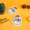 Christmas Friends â Snowman Eco Sponge | Doyourclean Snowman-shaped cellulose sponge from Doyourclean Christmas Friends collection on yellow holiday setup.