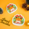 Santa Friends â Reindeer Biodegradable Sponge | Doyourclean Reindeer-shaped cellulose sponge with ribbon design and Christmas ornaments.