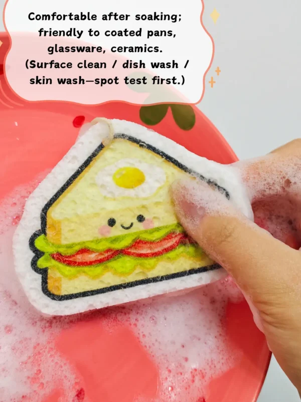 Sandwich-shaped cellulose sponge being used for dishwashing with foam and water.