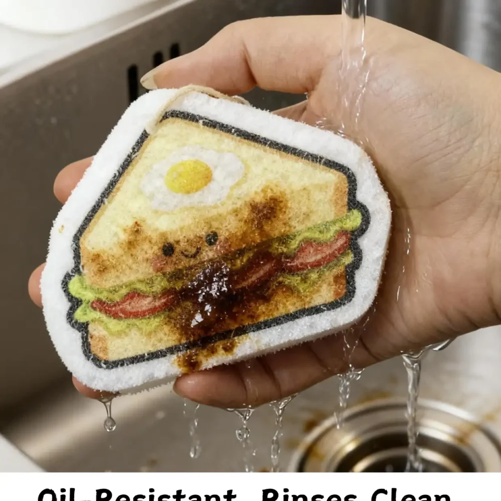 Sandwich-shaped cellulose sponge rinsing off oil under running water.