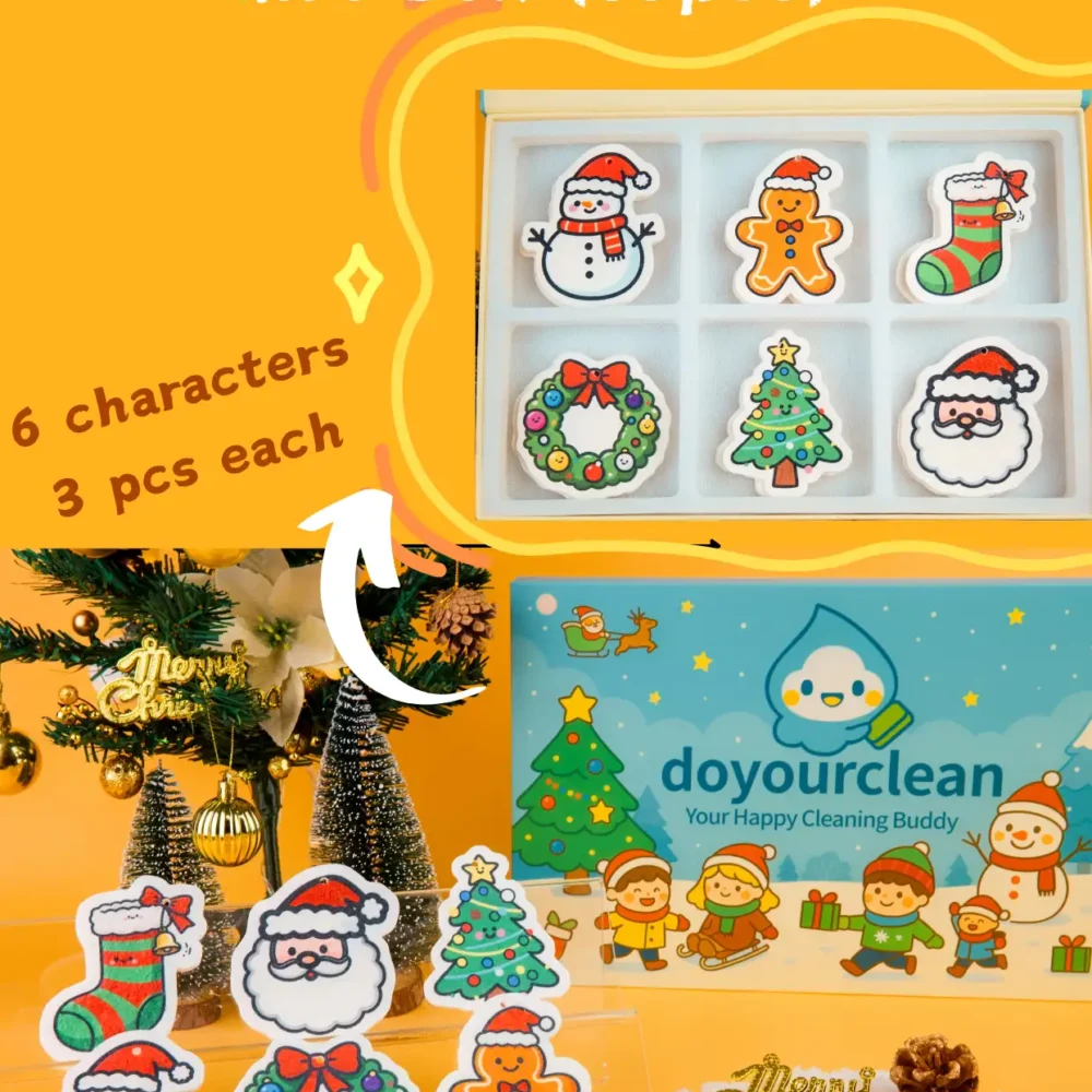 DoYourClean Christmas Friends 18-piece cellulose sponge gift box with six cute holiday characters on an orange background.