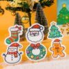 Christmas Friends â Holiday Sponge Set | Cute Eco Christmas Dish Sponges Six Christmas Friends cellulose sponges from Doyourclean â including Santa, snowman, wreath, and Christmas tree â displayed on a snowy festive background.