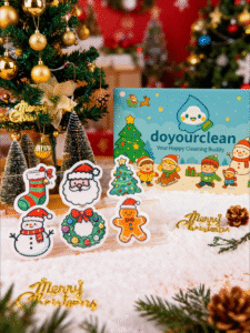 Christmas Friends cellulose sponge gift box displayed with Santa, snowman, gingerbread, wreath, stocking, and Christmas tree character sponges in a festive holiday setup.